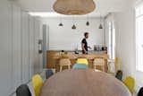 “Perhaps the most recurrent request from the client was to create as much storage space as possible, which they desperately lacked in the original apartment,” Hammer says. The kitchen’s medium-density fibreboard cabinets provide plenty of room to keep things tidy. Tom Dixon bar lamps hang over the island.