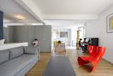 When Hammer and his team were discussing the home’s orientation with the couple, they decided to put “the kitchen on the east side, enjoying morning light, while having the living and dining areas open to the west terrace, ideal for afternoon light,” he says. A Felt Chair by Marc Newson for Cappellini adds color to the family room.