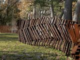 These Cor-Ten fence features a snaking structure that's both function and art.