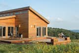 Located seven miles from Frank Lloyd Wright’s estate, Tim Wright and Karen Ellzey’s prefab home is meant to pay homage to the great American architect’s experiments with modular housing. 