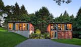 This prefabricated kit house by Adam Kalkin is designed from recycled shipping containers. Its 2,000-square-foot plan includes three bedrooms and two-and-a-half baths. The shell of the Quik House can be assembled in one day, and the entire home can be built in three months or less.