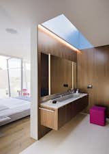 During the day, a skylight illuminates the master bathroom.