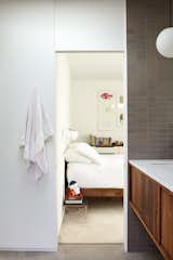 Among Jessy’s favorite original details are the door headers, which are the same width as the doors themselves. A fresh coat of white paint from Sherwin-Williams gives the house a clean look. The bathroom tile is by Heath in French Gray Manganese.