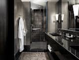 The dark-hued bathroom feels like a sanctuary.