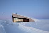 Eivind Bøhn’s cabin on the outskirts of Hardangervidda National Park is a modern update of the classic Norwegian <i>hytte</i>. The design, by Snøhetta architect Øystein Tveter, features a sod-covered roof that blends with the grassy hillside in warmer months.