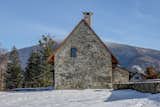 Set in the Beskids nature reserve Čeladná, the Czech holiday home offers awe-inspiring scenic views in every direction. The two-part structure was originally built to serve as a house and barn.