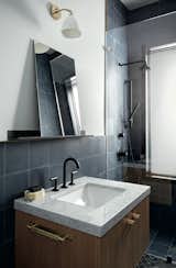 The bathrooms are outfitted with Jason Wu for Brizo fixtures. The Bestlite BL7 wall lamp by Robert DudleyBest for GUBI hangs above a marble-topped vanity.

Designed by Studio Zung.