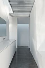In the master bath, a Boffi tap pairs with a Kohler sink.