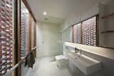 The custom towel rails in this bathroom are also meant to mimic branches.