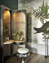 Custom Alison Rose of Artistic Tile completes the decadent scene, with marble accents on the floor and walls.