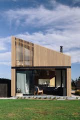 "The exterior's cedar rain screen provides a clean form without the sometimes clunky junctions of what is a simply a cost-effective steel shed behind," Daniel says. "The panels can be unscrewed and oiled." Daniel uses Dryden WoodOil on the panels when needed. 