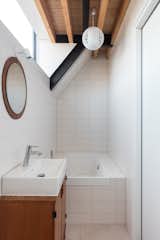 A clerestory harnesses natural light for the bath.