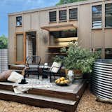 Banjo, a tiny home in Byron Bay, Australia, is clad in Weathertex and features a commodious deck and a plunge pool fashioned out of a stainless-steel water tank.