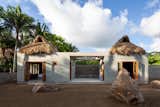 The compact retreat in Nayarit, Mexico, that Palma designed for an American couple comprises two stucco-clad volumes connected by a patio. The oculus above the open space frames the sky.