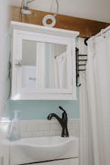 White subway tile and pale-blue paint enliven the bathroom, which the Binkerds expanded to make room for a claw-foot tub.