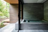 The outline of the bath appears to extend to the exterior of the home. 