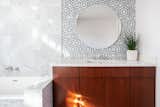 The bathrooms have been tastefully remodeled with Carrara marble and walnut cabinetry.