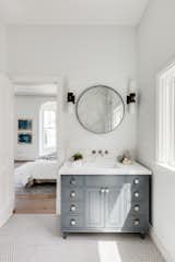The master bath features penny tiles on the floor. 