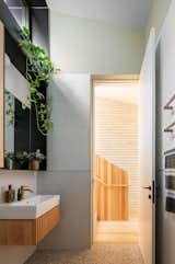 The second bathroom features a vanity with similar detailing.  