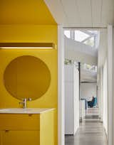 A cheerful yellow bathroom.