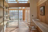 Glazed, sliding partitions are used to separate or connect the rooms and functional zones. This makes the interiors adaptable enough for a variety of programs.