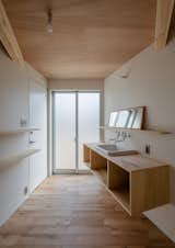 Built-in wooden storage and shelving systems keep the interior clutter-free.