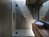 A skylight brightens the shower area.