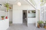 One of the kitchen's panel doors opens to reveal a hidden bathroom.