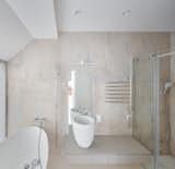 A bathroom is the only enclosed space on the upper level.