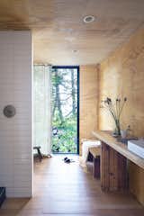 The countertops and interior cladding were created from reclaimed beams and siding from the original cabin. 