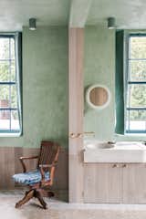 An antique chair near the ensuite bathroom.