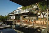 The homeowner of Via Media Residence needed a workspace that would stand separate from domestic life. Matt Fajkus Architecture added a freestanding structure that acts as both a studio and a pool house—and is strategically positioned to frame views of the pool, the hills, and the cactus-filled slope in the back.