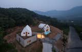 The 2,026-square-foot house is split into two structures, with an underground garage separating the two halves. 