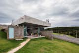 The firm worked to provide as much outdoor access as possible, so the living spaces spill out onto a protected veranda, and a ladder climbs up to the green roof.
