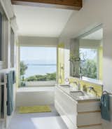 A custom vanity echoes the other cabinetry in the house.