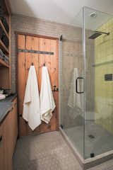 The bathroom sports Heath tile in classic field sizes, in the Steam and Ochre glazes. 