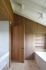 Peaked ceilings continue in the en suite bathroom.