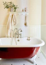 A cast-iron clawfoot tub from Vintage Tub & Bath received a bold red paint job.