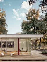 The strip between the glass panels is Ipe, same as the deck, it’s just retained its original hue beneath the four-foot-deep overhangs. The deck is wrapped in a steel channel, in a nod to the steel used inside.