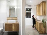 White oak cabinetry was custom built and fabricated by FWD.  Polished concrete floors and white tile compliment the warm wood tones.