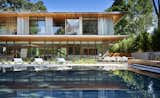 Visual transparency between indoor and outdoor spaces transcends throughout the property. From the pool, private balconies on the second level are revealed as the aluminum maneuvers fold away. 