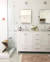 “For the master bathroom, I wanted to create a spa-like retreat for my husband and I. We chose classic finishes with gray herringbone floor tile, white subway tile for the walls, and chrome fixtures and hardware. We also took down a wall that separated the toilet and shower from the sink area and it made the bathroom feel twice as large.”
