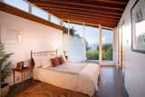 The first bedroom shares the long main wall with the living room on the other side.   Photo 6 of 14 in Grab This Sleek L.A. Midcentury by John Lautner For Under $2M