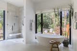 The master bath includes a Badeloft freestanding tub and Aquabrass fixtures.