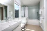 The home includes four full baths.