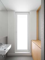 Gray Céragrès ceramic tiles line the bathroom.