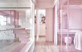 A view from the master bedroom toward the stairs (behind the sliding door). On the right side is the dressing room, and to the left is the cats’ room, framed by large smart glass panels that change opacity with the touch of a button. 