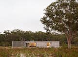 The two-bedroom, two-bath Courtyard House is located in a clearing in the New South Wales coastal suburb of Hawks Nest, just a few minutes’ drive from the beach.