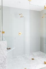 New master shower with marble and Kohler fixtures