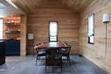 Intimate, wood-clad main rooms create a cohesive atmosphere.